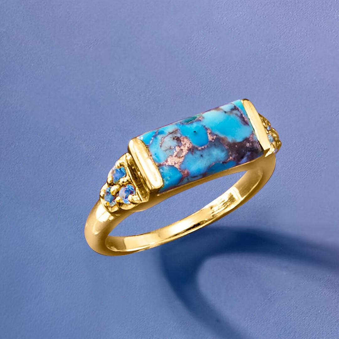 Anillo llamativo dorado con barra turquesa