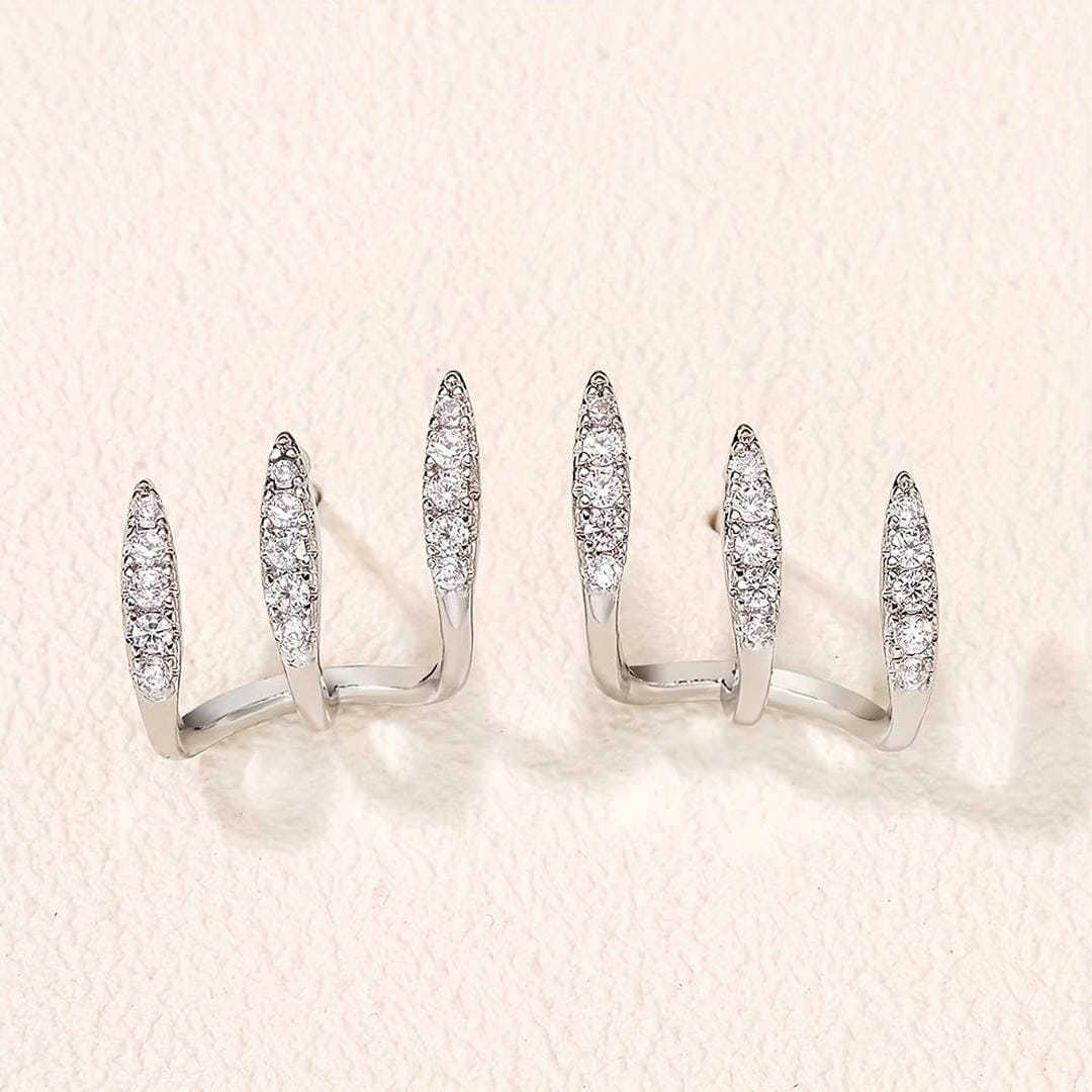Elegantes aretes de rinocerontes de tres garras