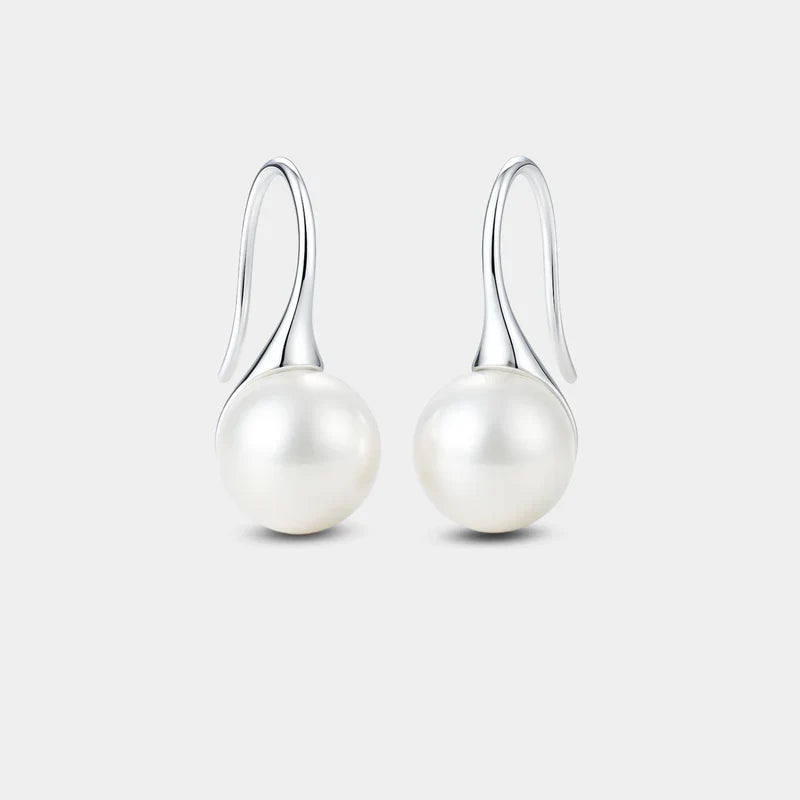 Elegantes pendientes colgantes con perlas