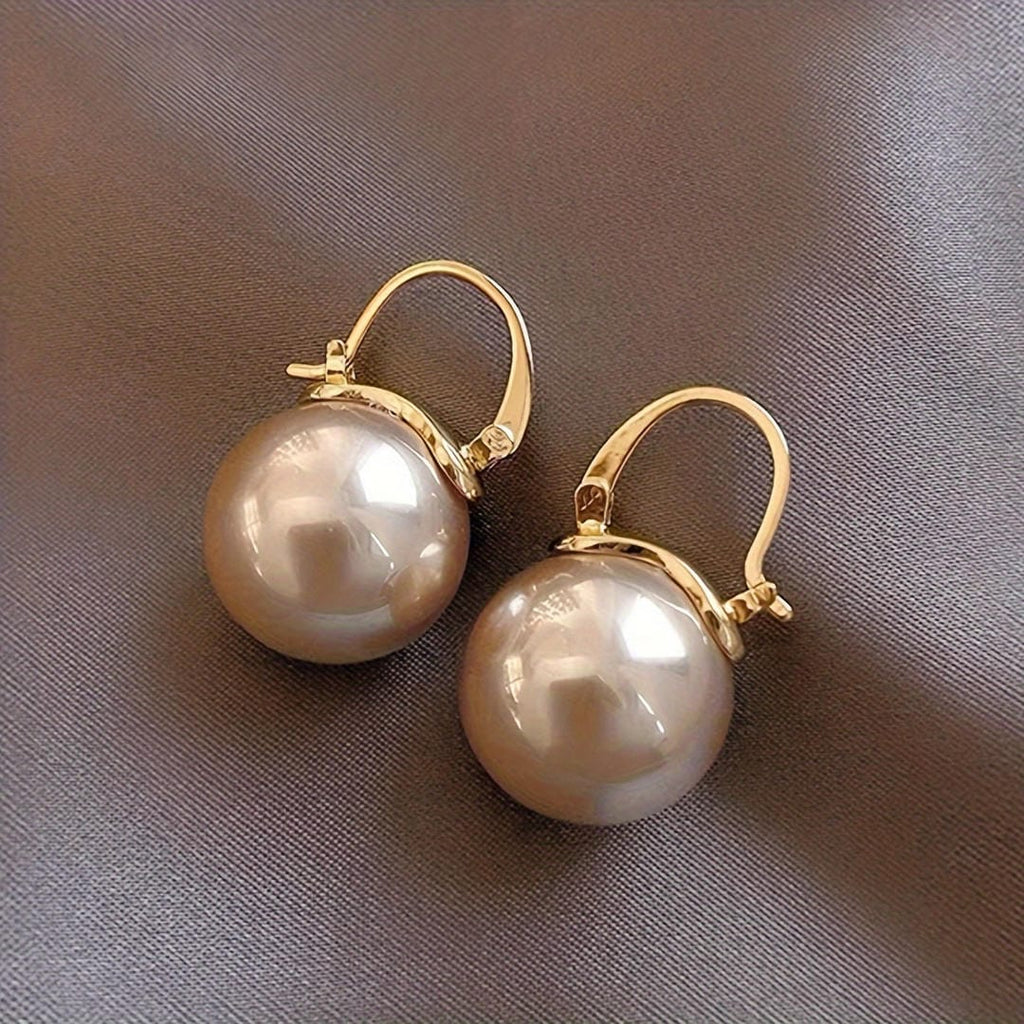 Pendientes de gancho con perla dorada