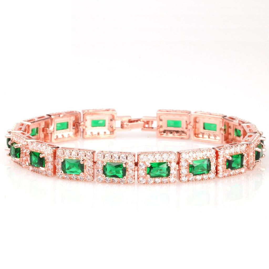 Pulsera llamativa dorada con esmeraldas