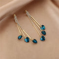 Elegantes pendientes de gota de lluvia de corazón de cristal azul