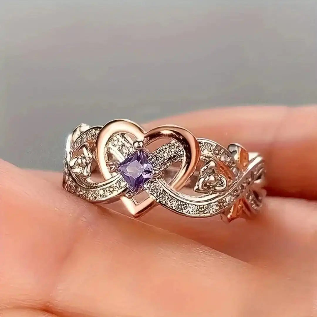 Anillo de oro y plata con corazón violeta