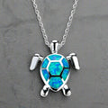 Collar de plata con dije de tortuga de ópalo azul