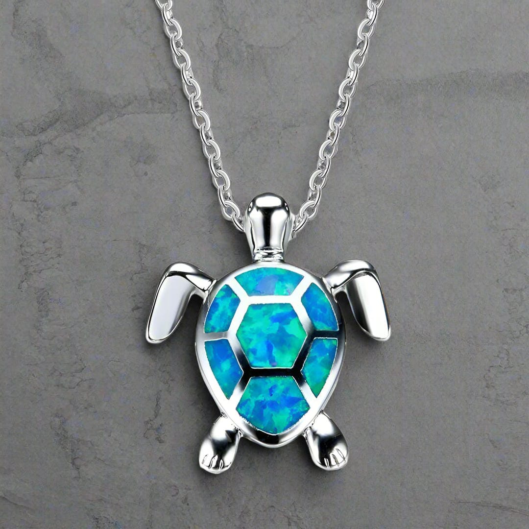 Collar de plata con dije de tortuga de ópalo azul
