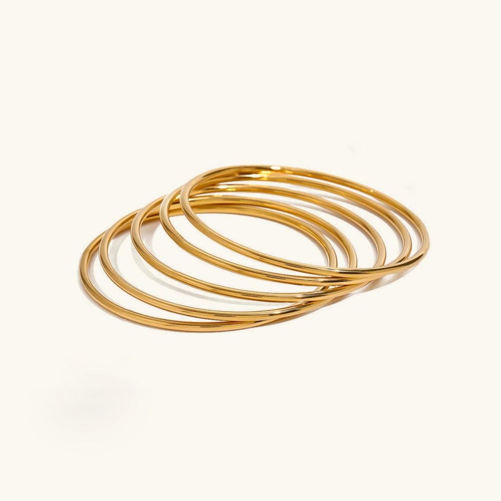 Deslumbrante juego de pulseras apilables de oro