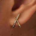 Pendientes de oro atemporales con cruz