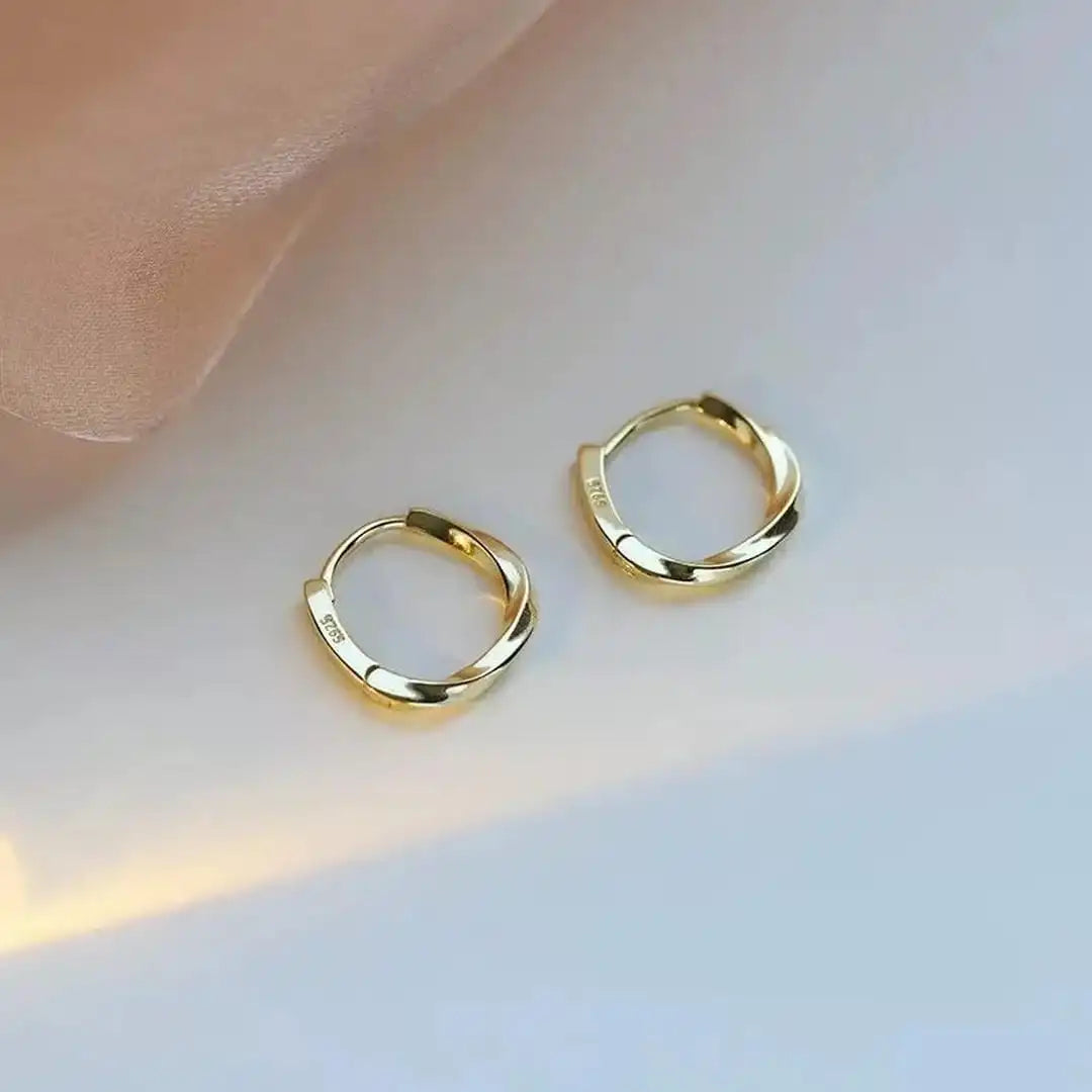 Aretes redondos con incrustaciones de plata de ley