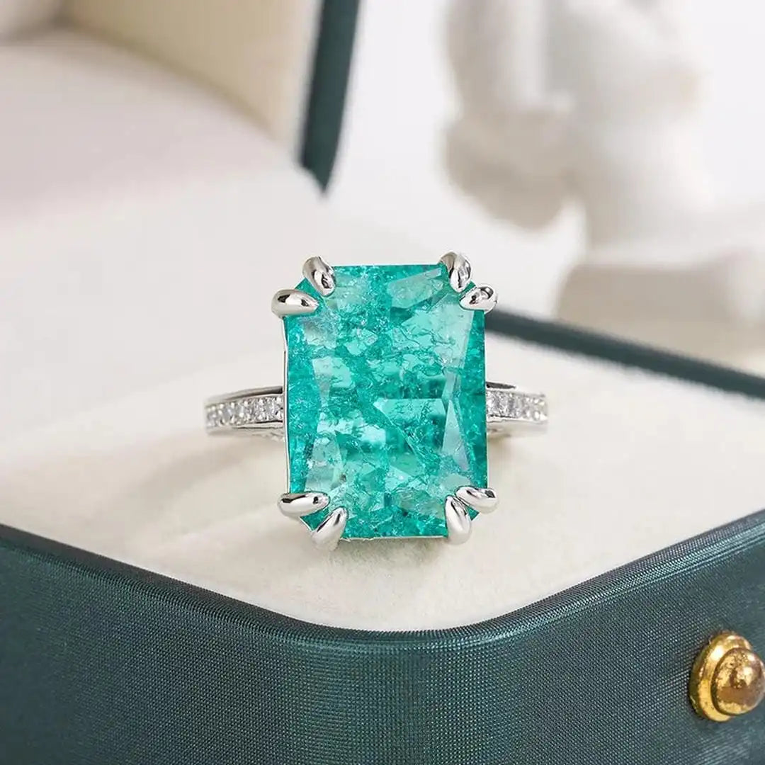 Exquisito anillo de moissanita azul verdoso