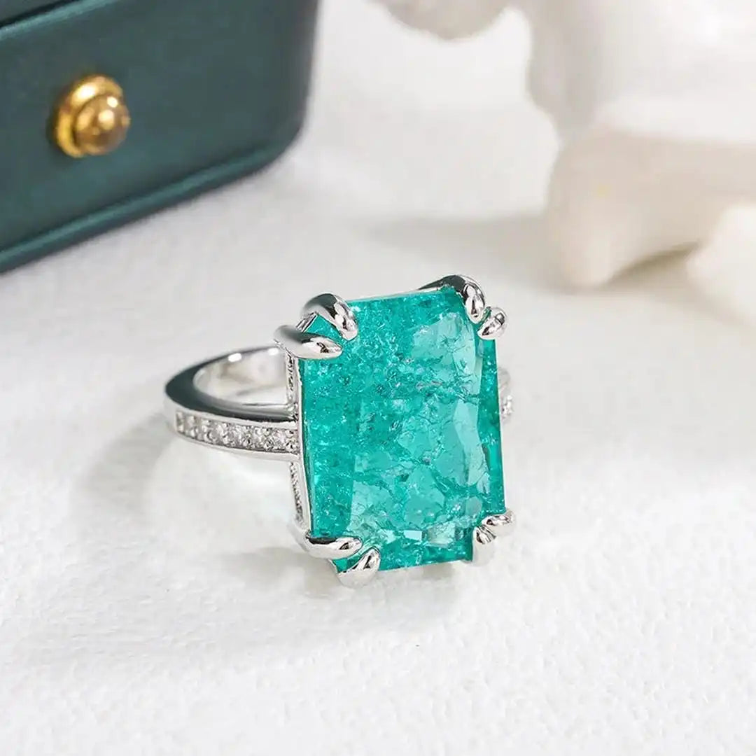 Exquisito anillo de moissanita azul verdoso