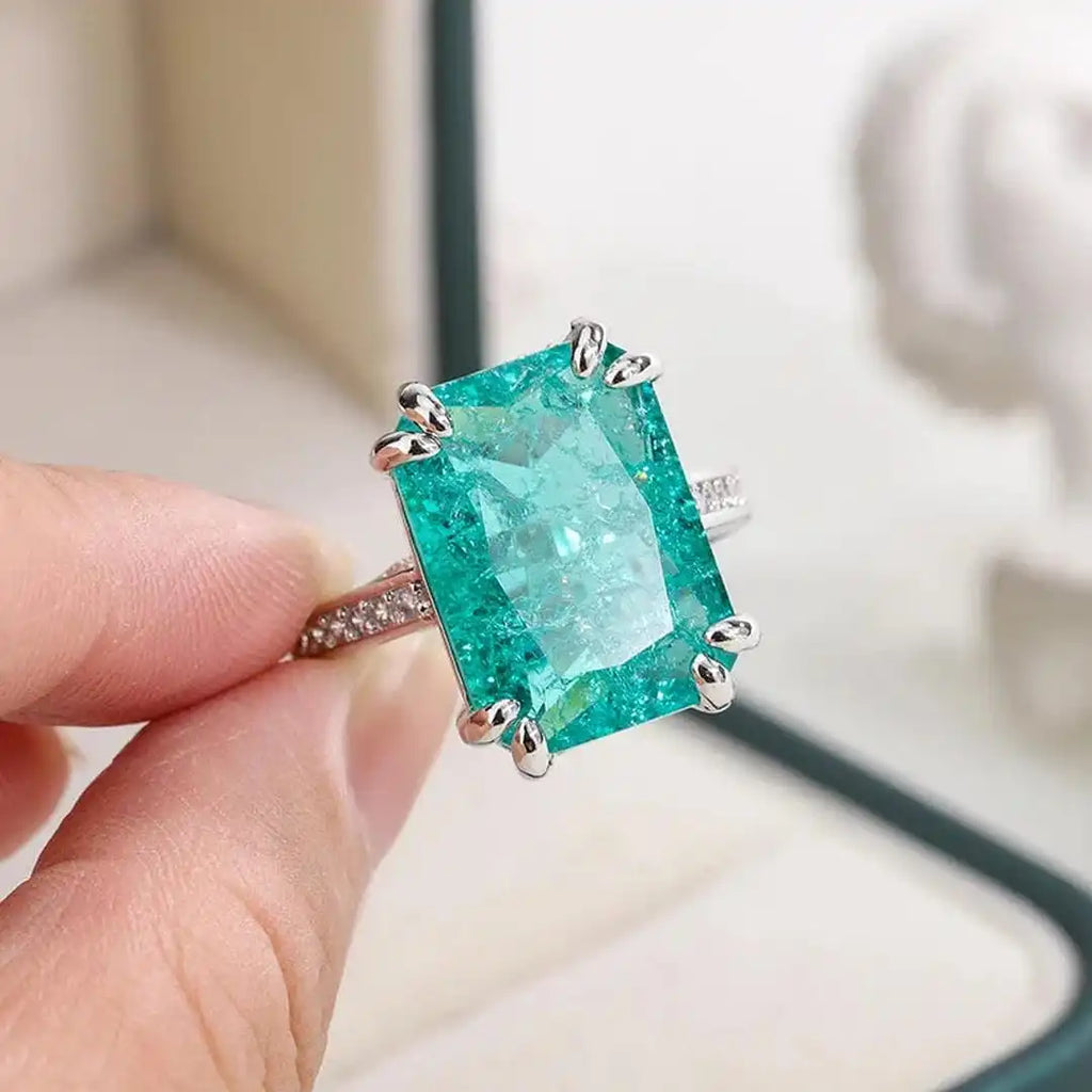 Exquisito anillo de moissanita azul verdoso