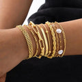 Juego de pulseras apilables de perlas doradas