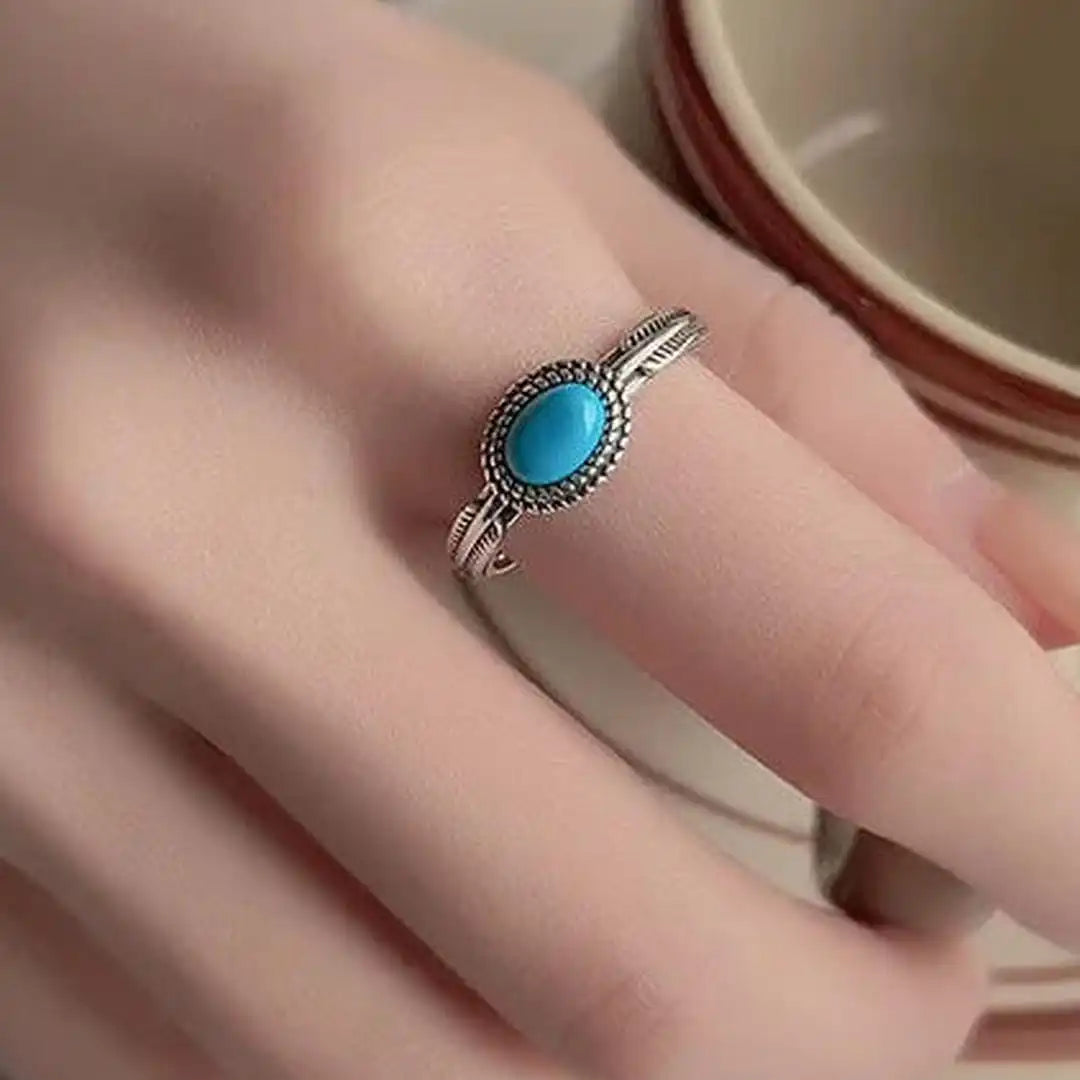 Anillo de plumas turquesas ajustable de plata