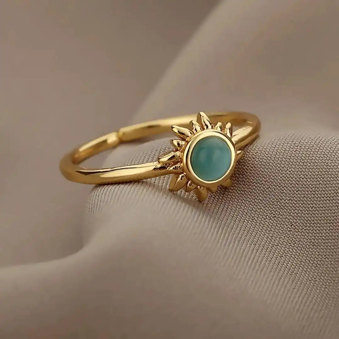 Anillos de sol de ópalo dorados y plateados