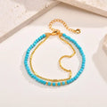 Pulsera de turquesa con doble cadena de oro, estilo atemporal