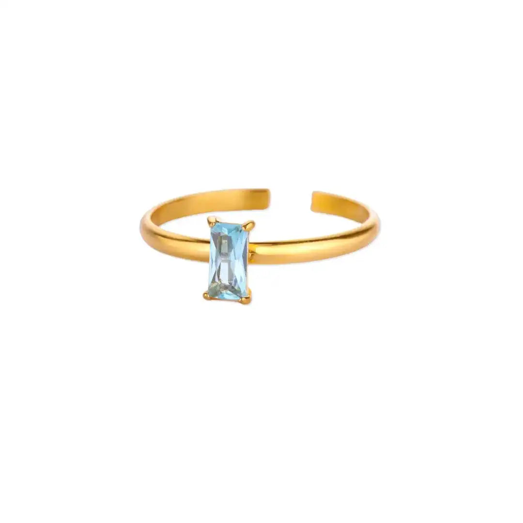 Anillo dorado ajustable y delicado con gema de colores