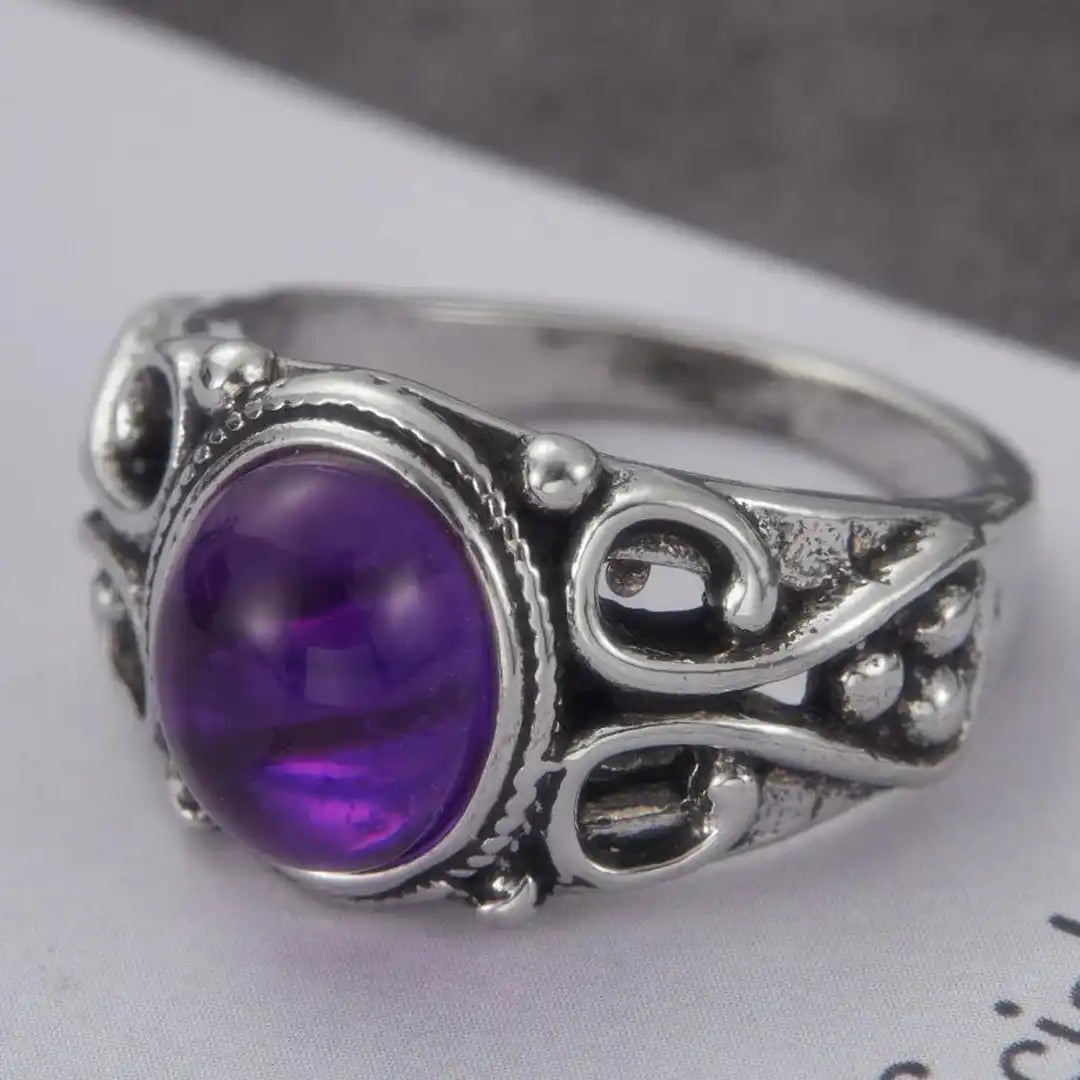 Anillo ovalado de pergamino plateado y morado clásico