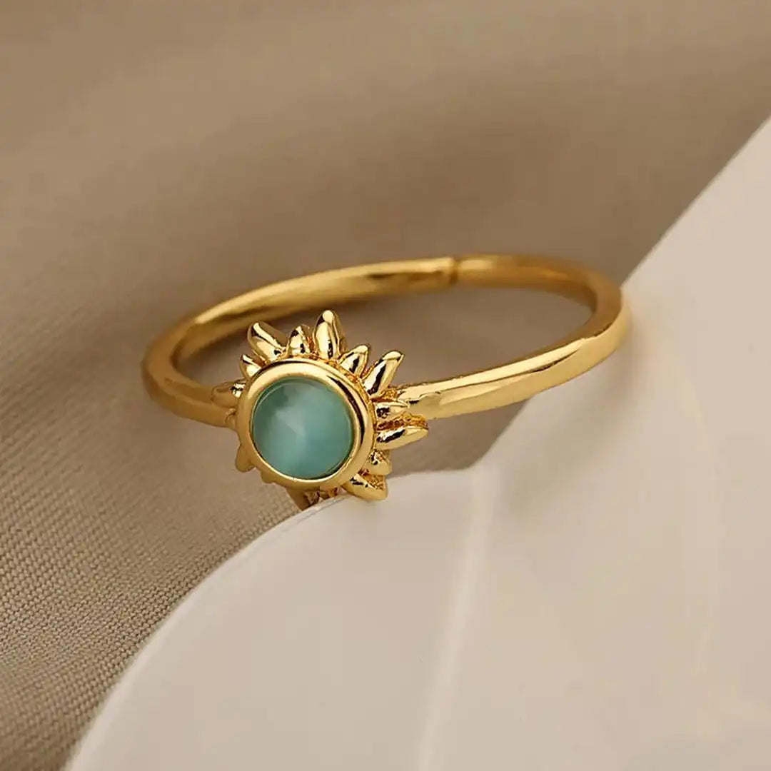 Anillos de sol de ópalo dorados y plateados