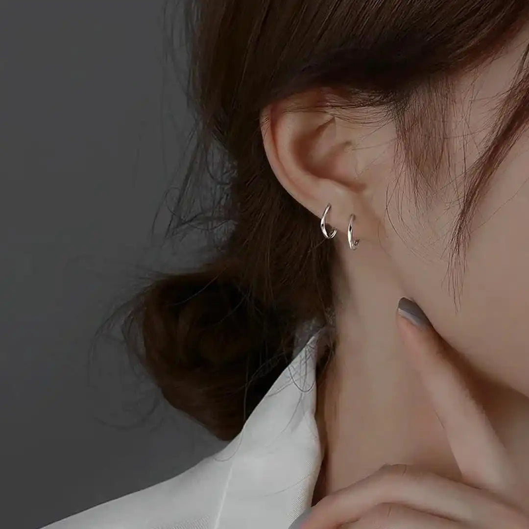 Aretes redondos con incrustaciones de plata de ley