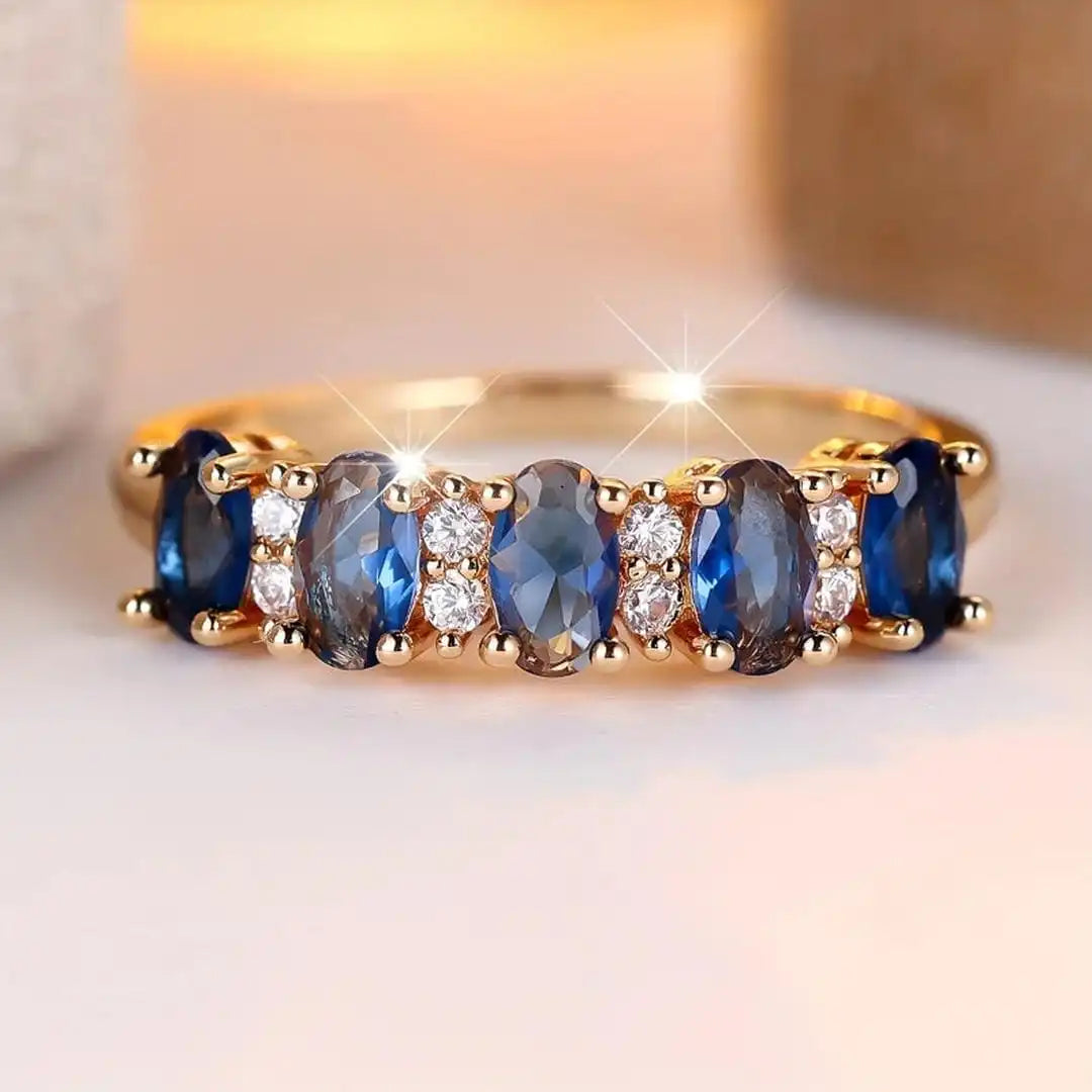 Anillo de banda con acento ovalado alternado