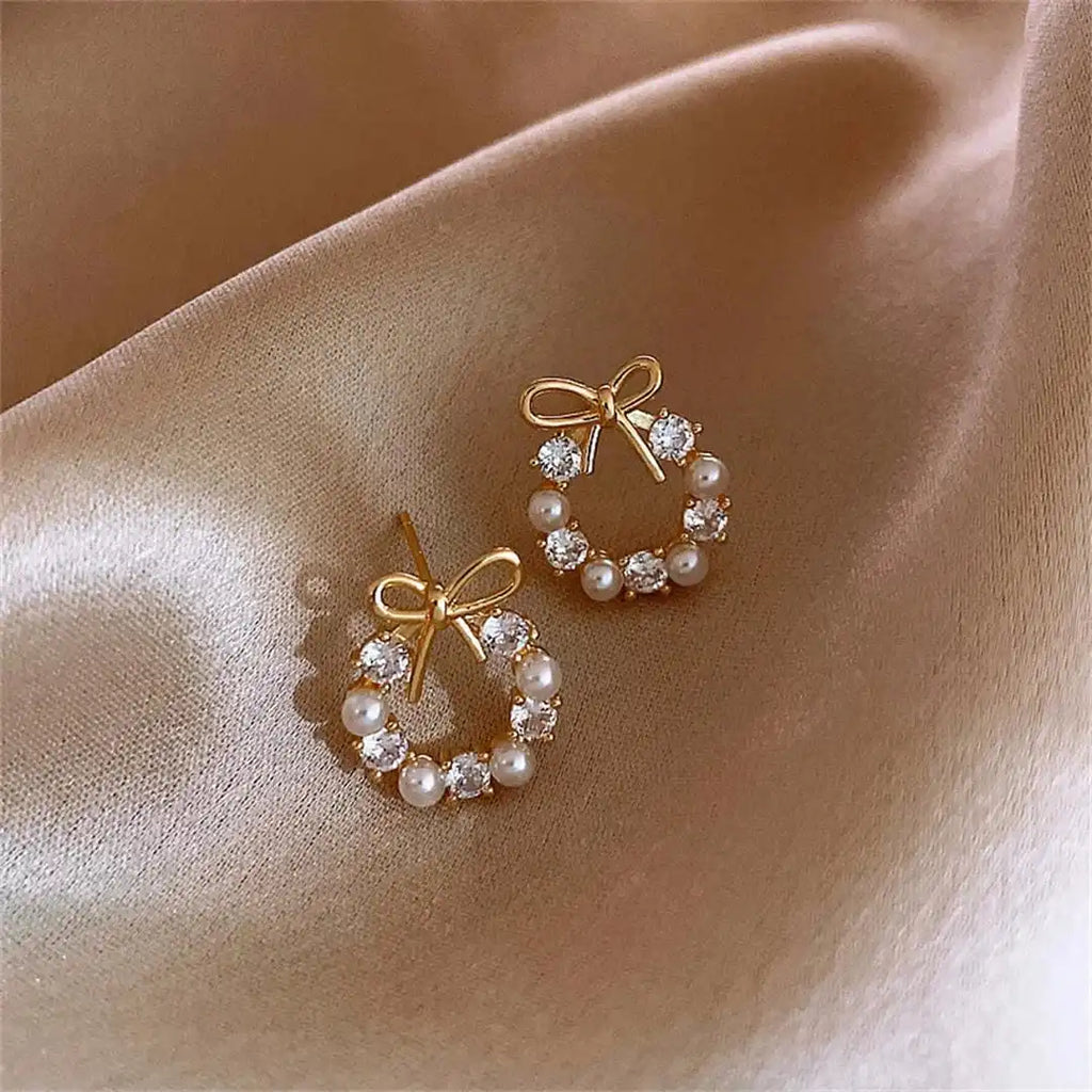Pendientes de perlas circulares con lazo