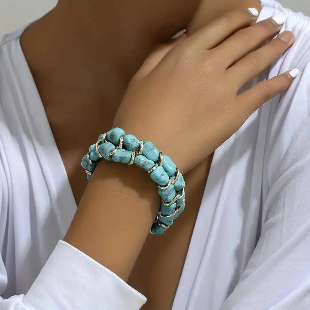 Pulsera de oro tejida con piedra turquesa