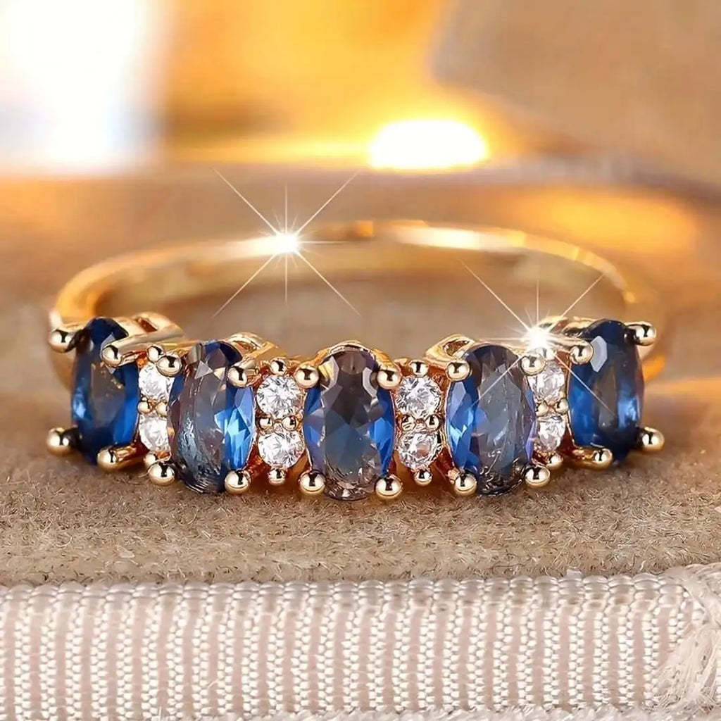 Anillo de banda con acento ovalado alternado