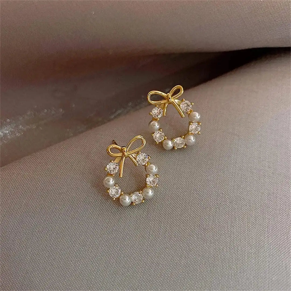Pendientes de perlas circulares con lazo