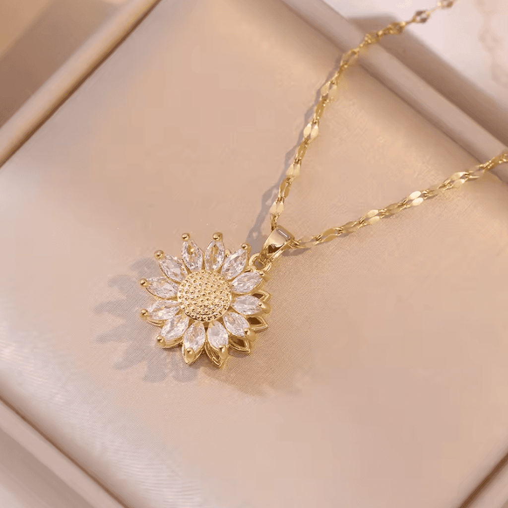 Elegante conjunto de collar y pendientes de circonita de girasol plateado