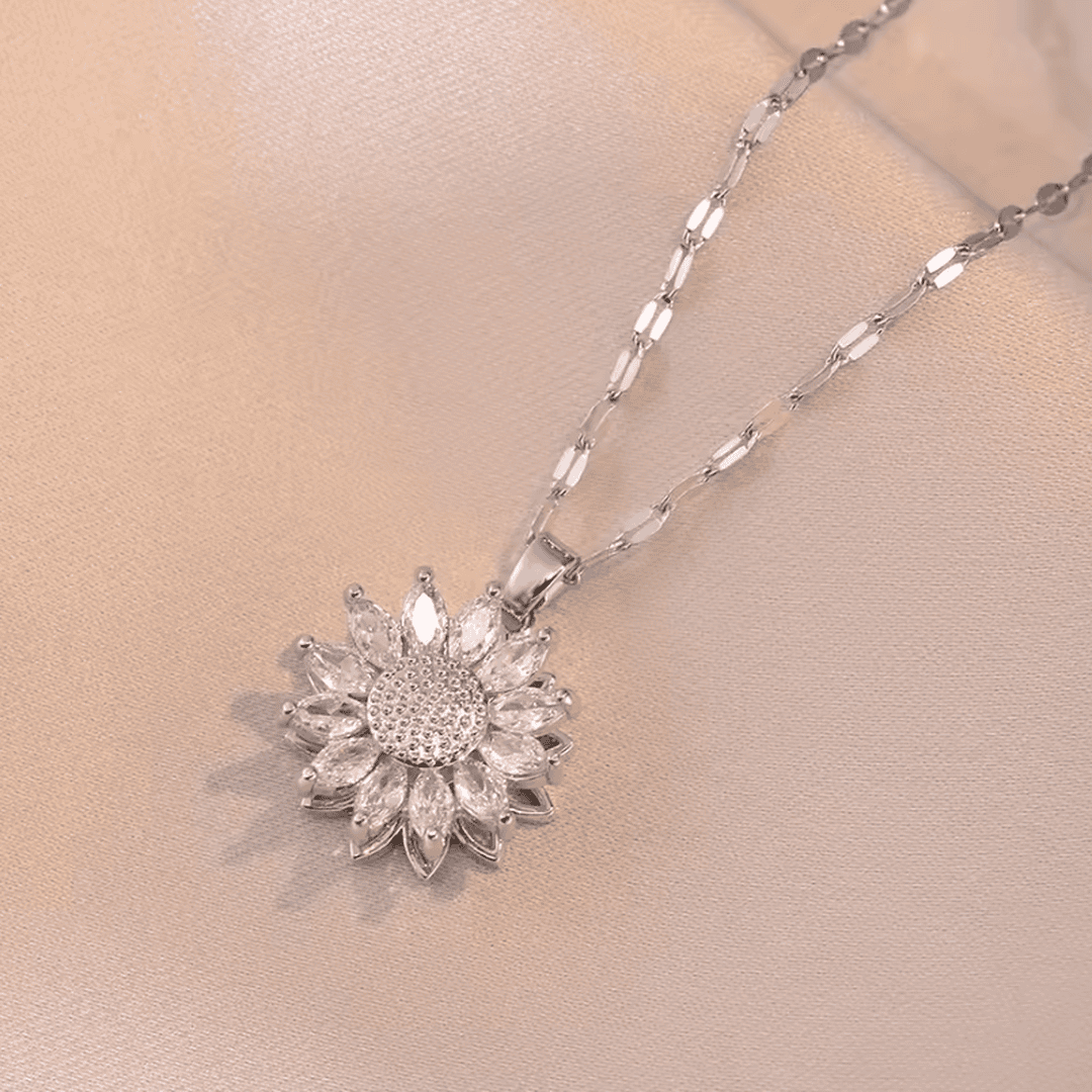Elegante conjunto de collar y pendientes de circonita de girasol plateado