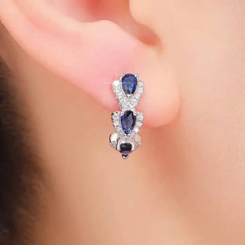 Pendientes con el escudo Zafiro Real