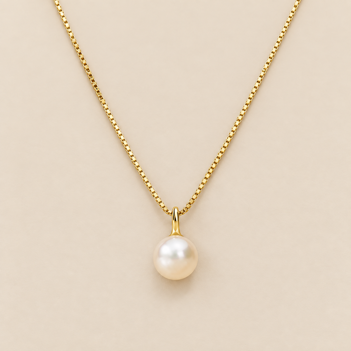 Timeless Pearl Pendant Necklace — cream studio photograph