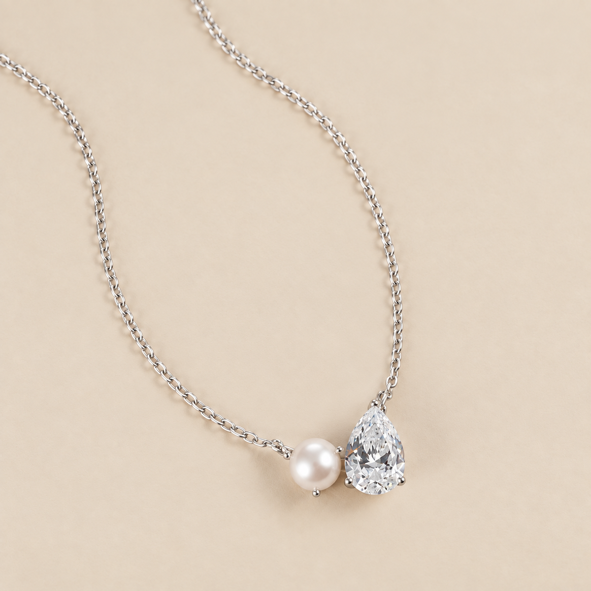 Pearl Teardrop Duo Charm Necklace — cream studio photograph