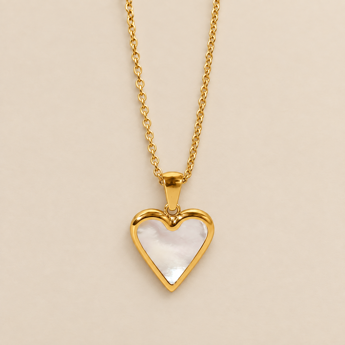 Gleaming Heart Pendant Necklace — cream studio photograph