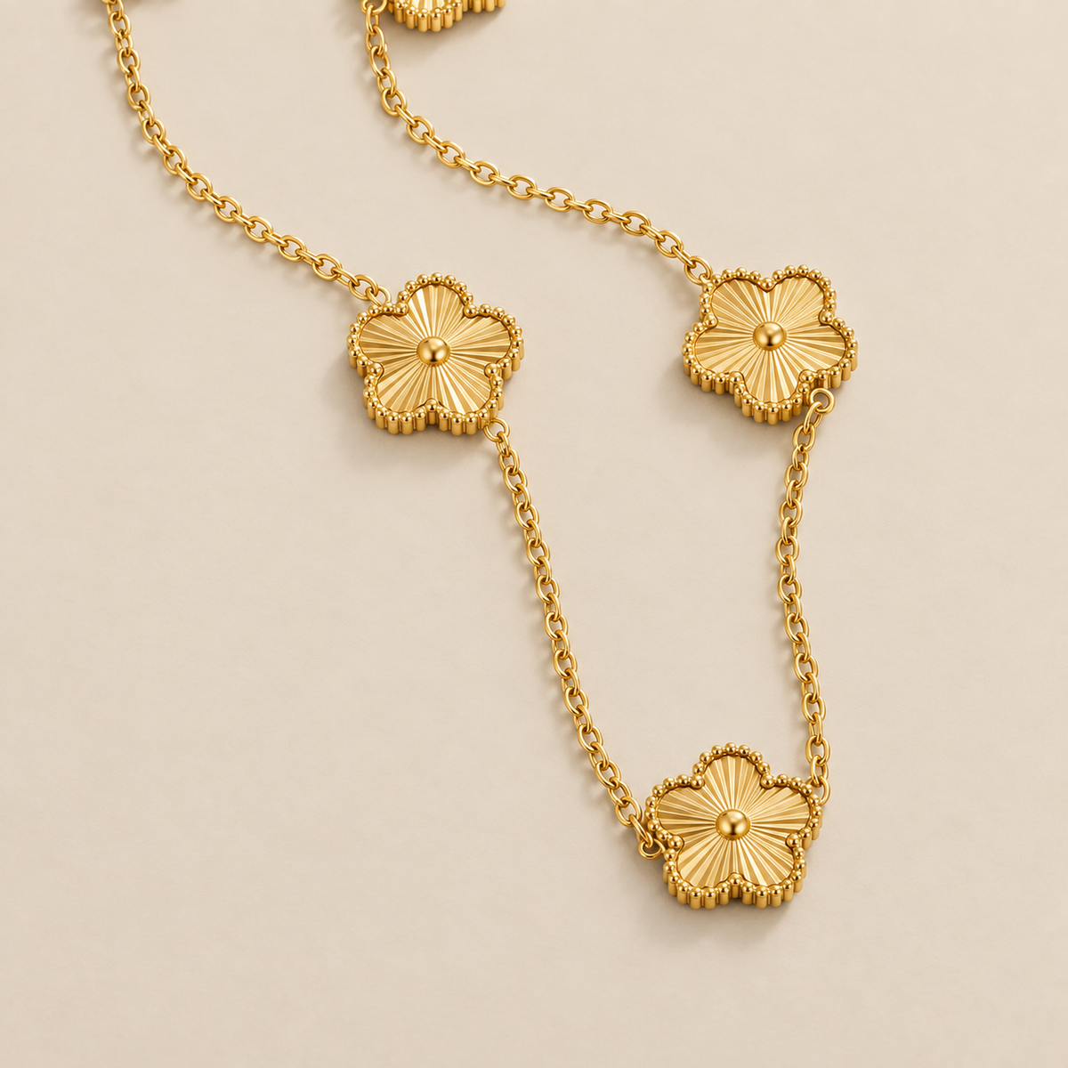 Golden Clover Cluster Necklace — cream studio photograph