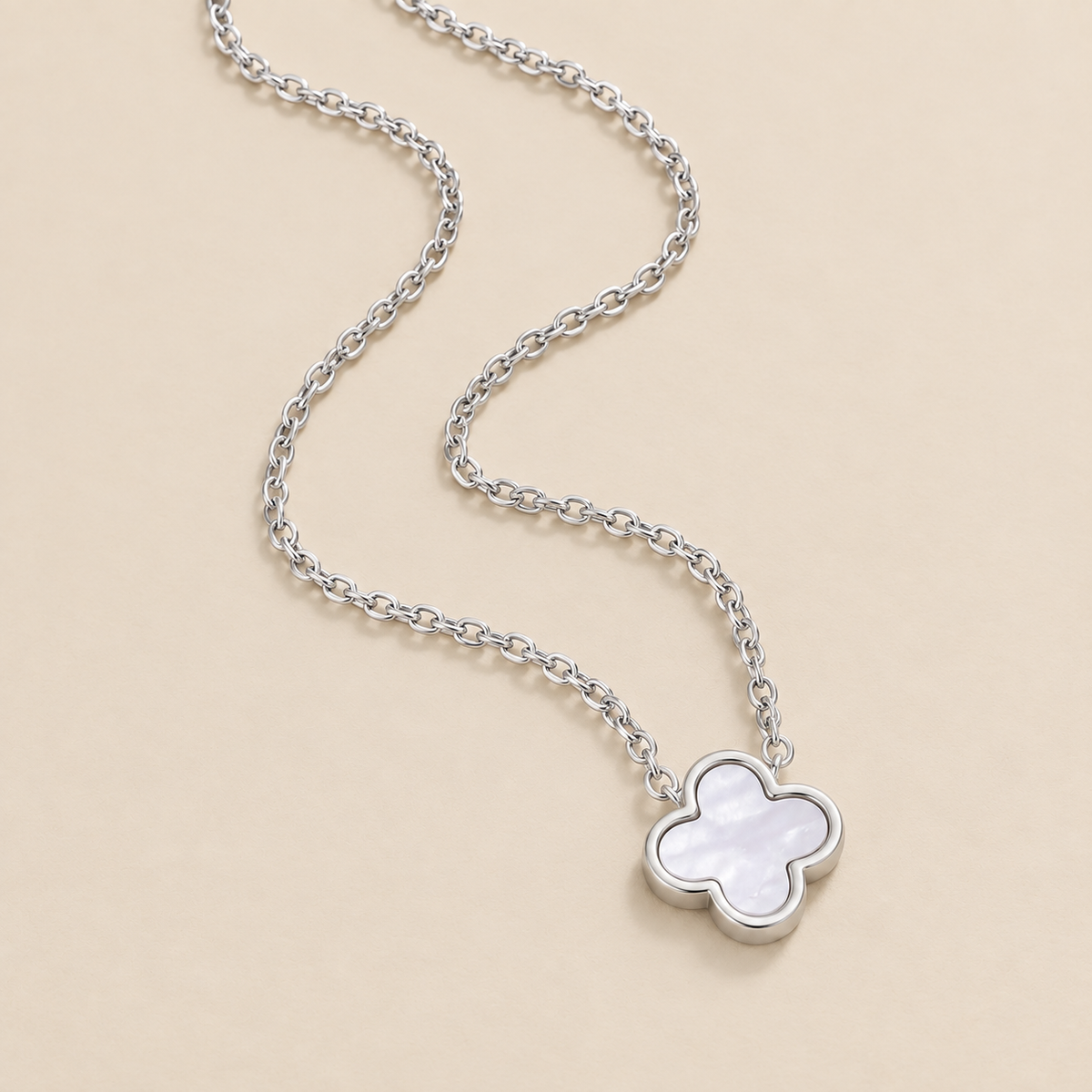 Silver White Clover Necklace — cream studio photograph