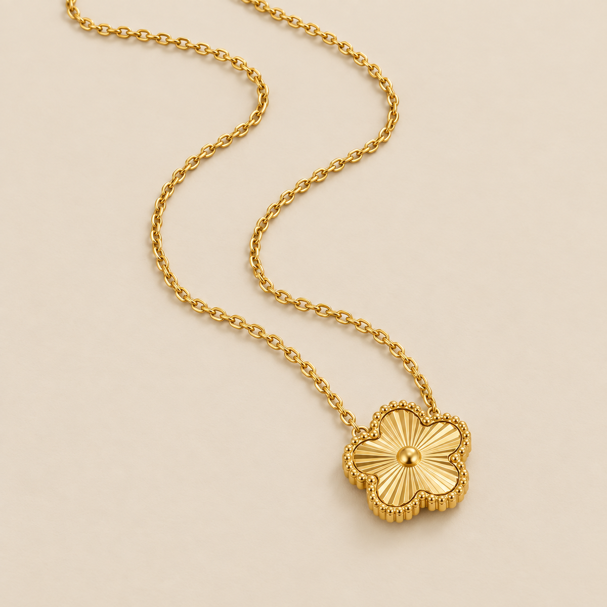 Golden Clover Necklace — cream studio photograph