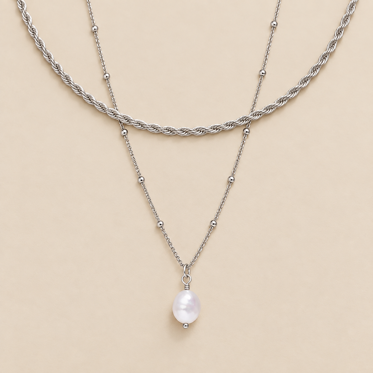 Pearl Pendant and Rope Chain Duo Necklace — cream studio photograph