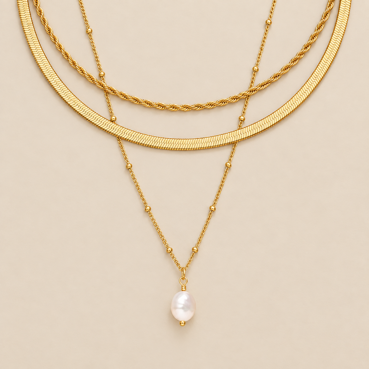 Timeless Trio Layered Necklace Set — cream studio photograph