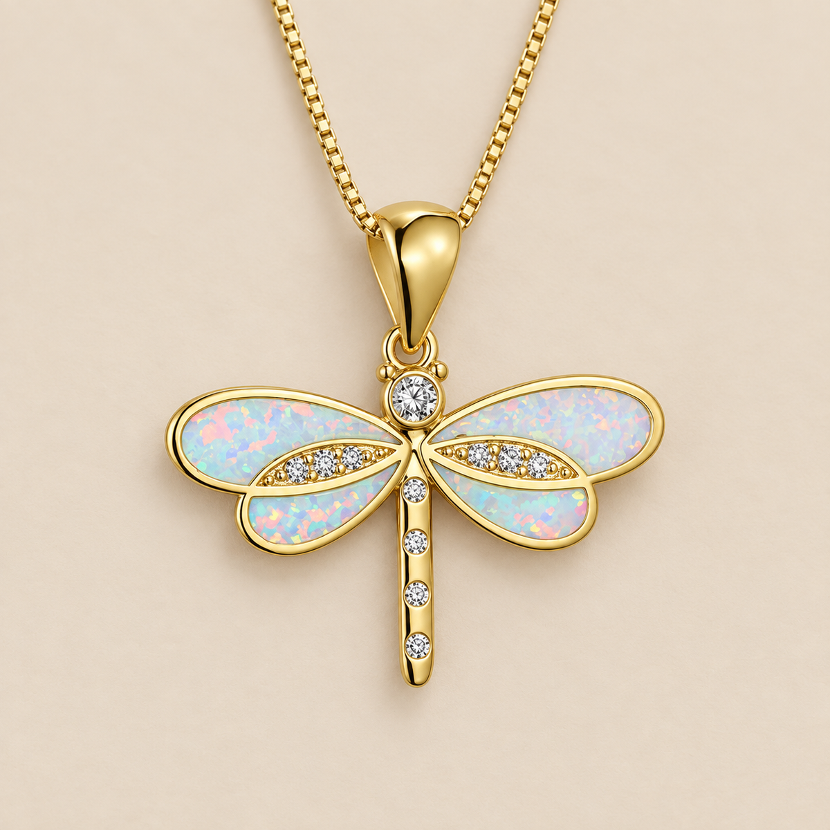 Dragonfly Necklace in Gold with Opal — cream studio photograph