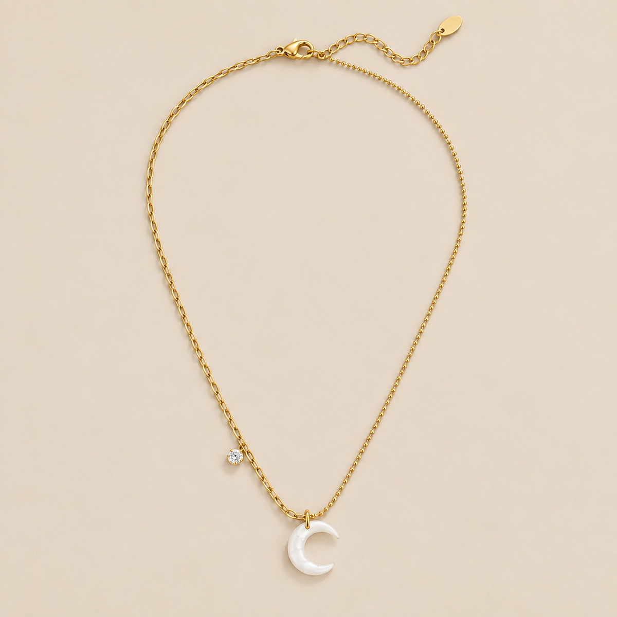 White Crescent Moon Necklace — cream studio photograph