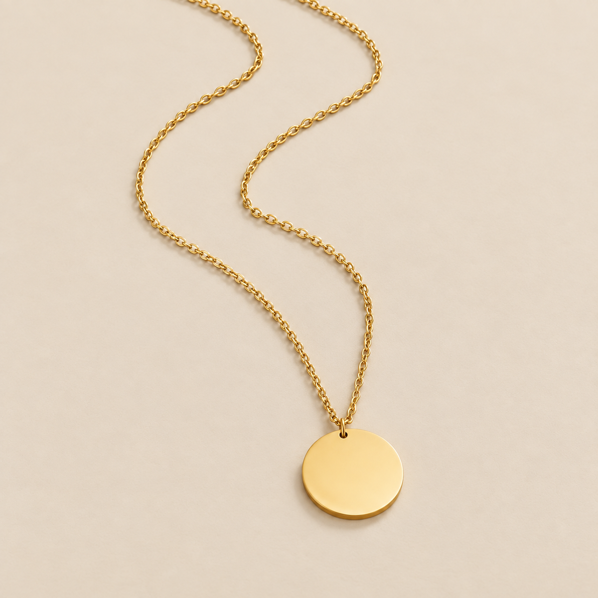 Gold Coin Necklace — cream studio photograph