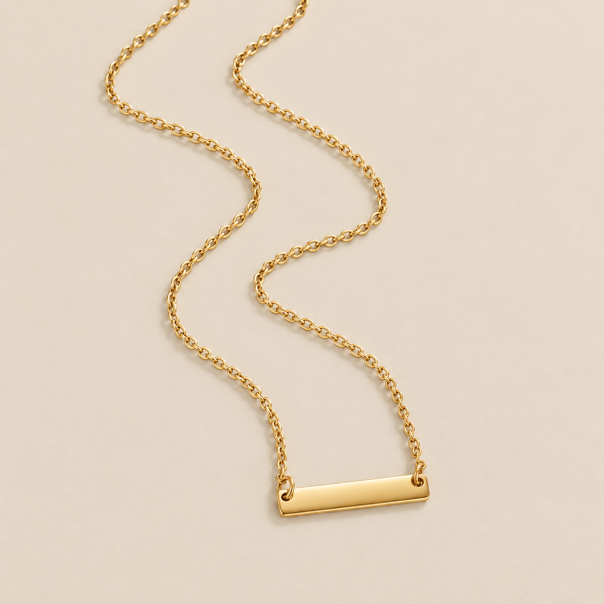 Rina Gold Bar Necklace — cream studio photograph