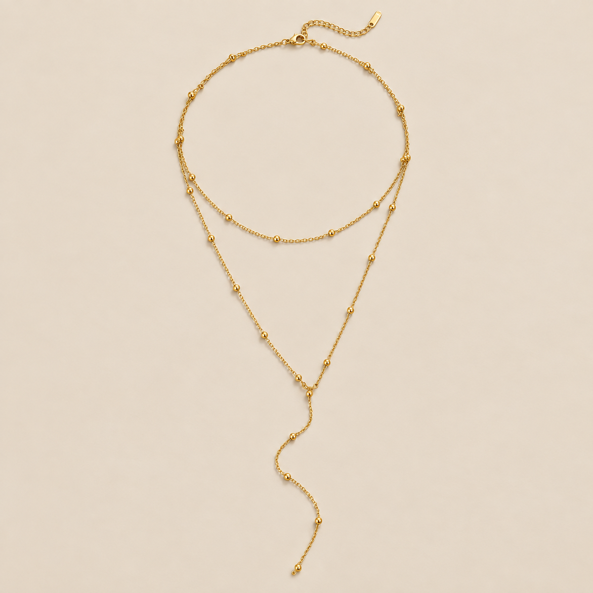 Layered Amara Tassel Necklace — cream studio photograph