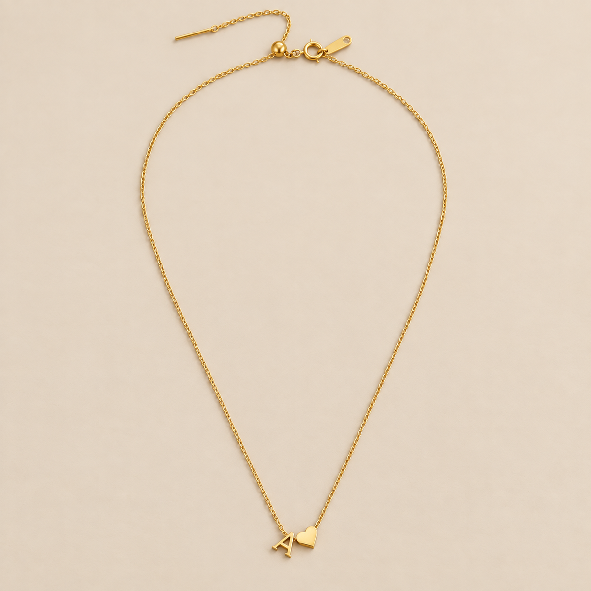 Forever Love & Letter Gold Necklace — cream studio photograph