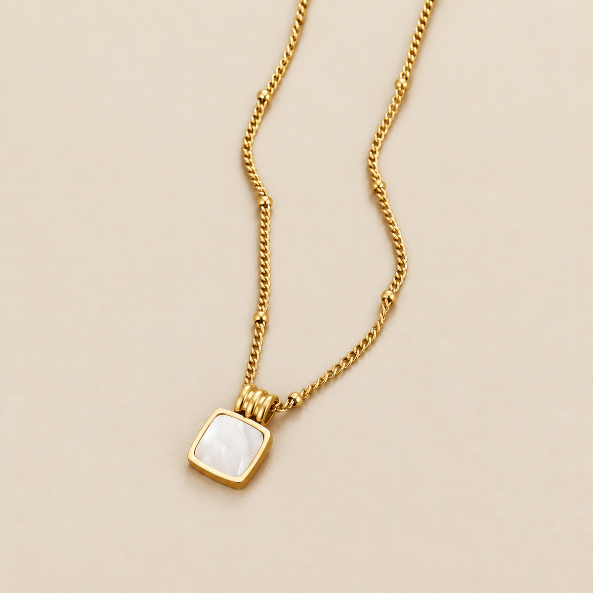 Lucia White Shell Pendant Necklace — cream studio photograph