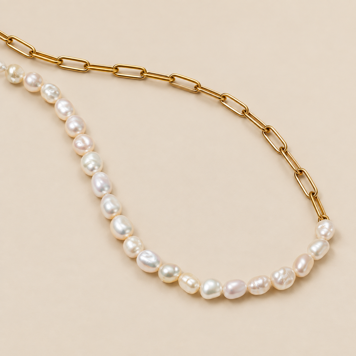 Gold and Pearl Split Necklace — cream studio photograph