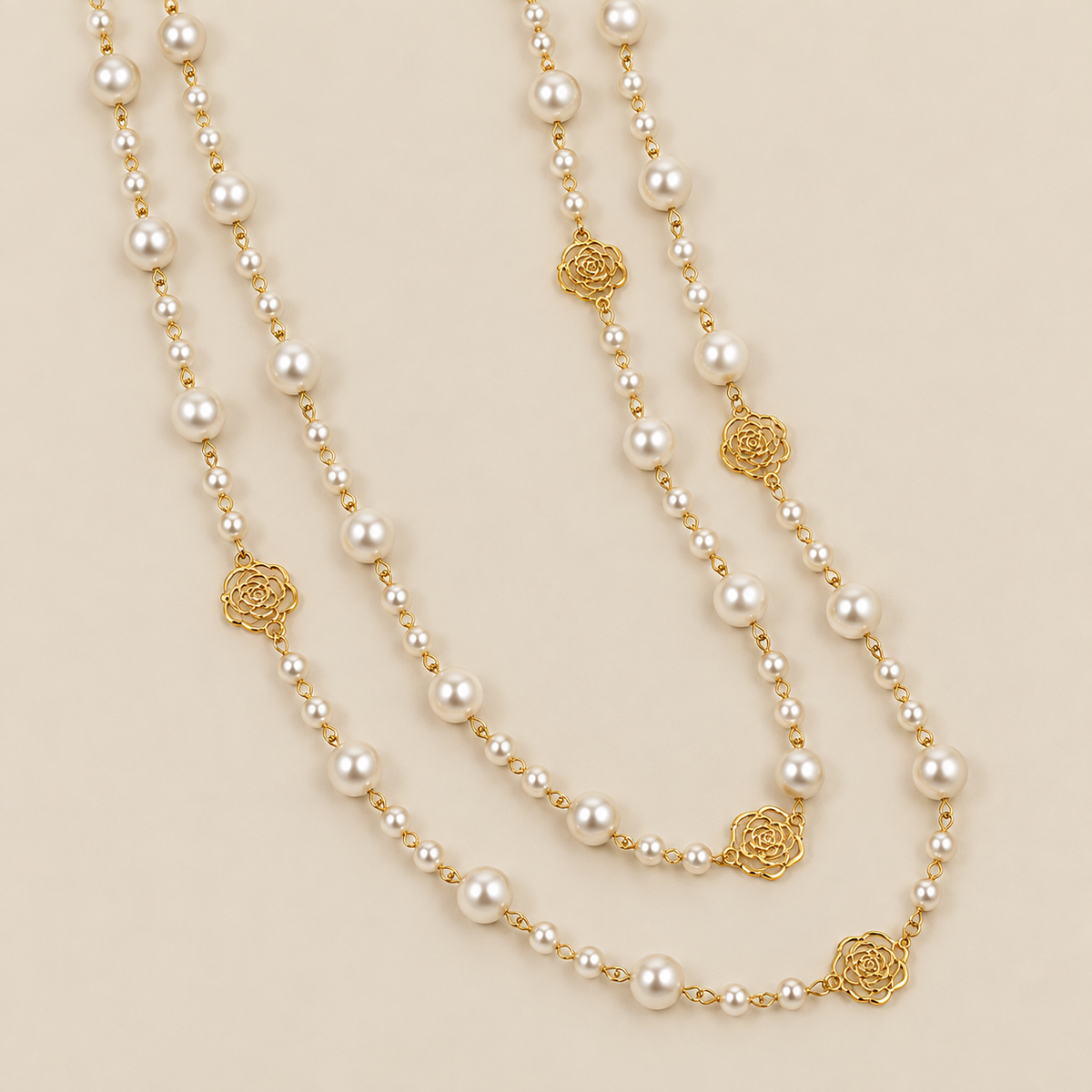Elegant Gold Pearl Necklace — cream studio photograph