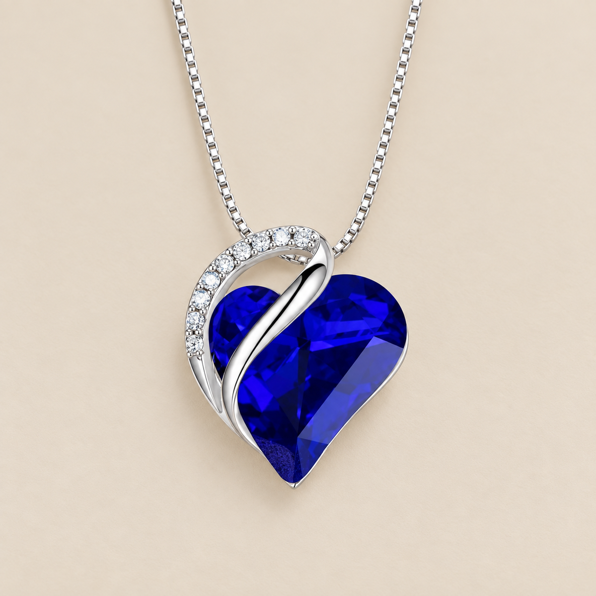Infinity Heart Sapphire Necklace — cream studio photograph