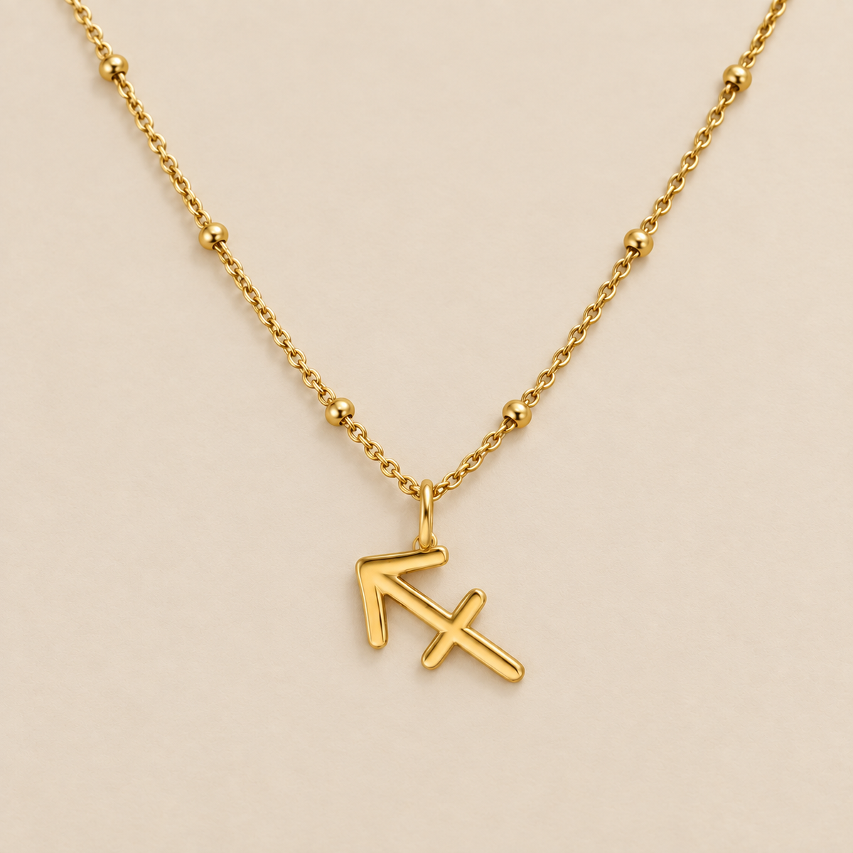Zodiac Harmony Charm Necklace — cream studio photograph